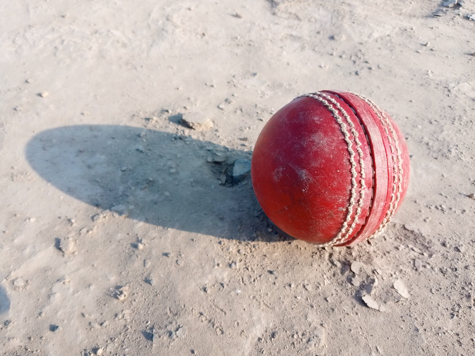 Hand stitched leather cricket ball showing the seam